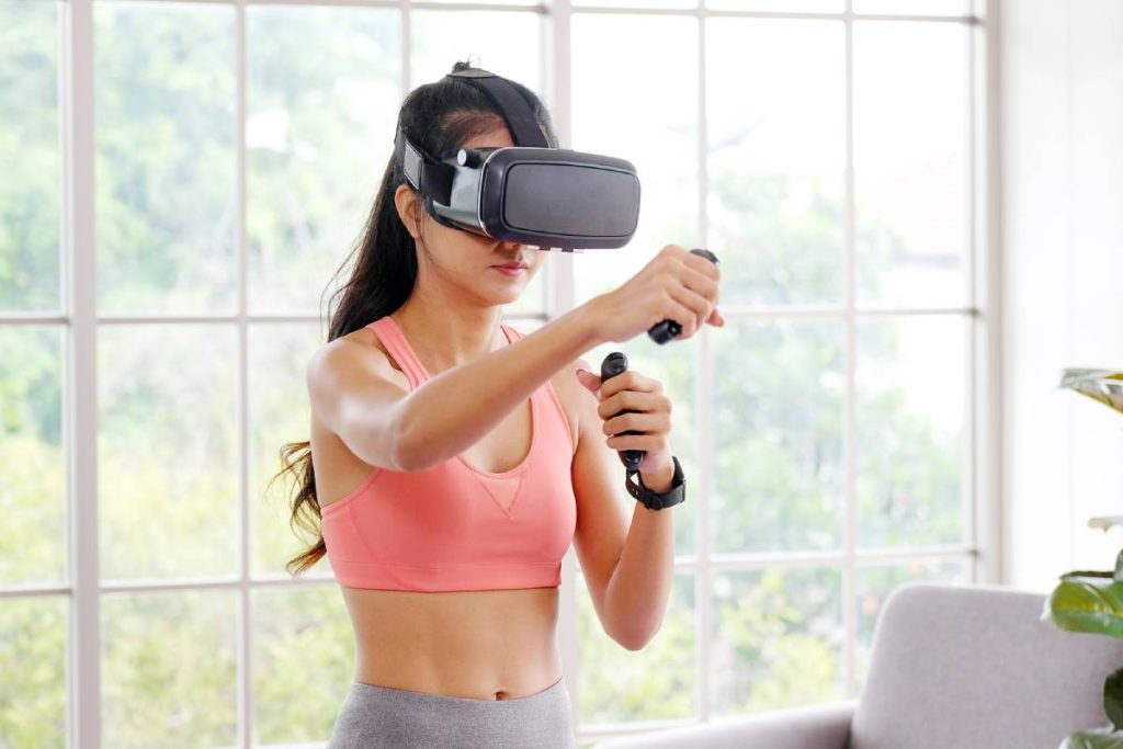 Woman working out while wearing VR headset