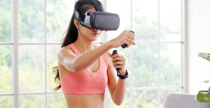Woman working out while wearing VR headset